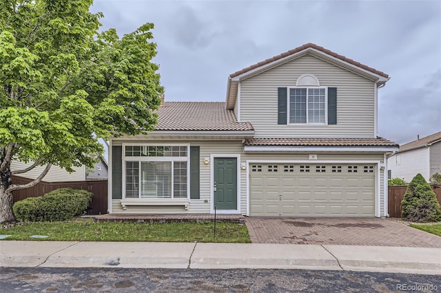20000 E Mitchell Pl Unit 35, Denver, CO 80249 - traditional-style house featuring a tile roof, decorative driveway, and a garage