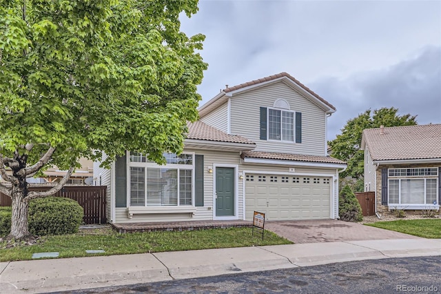 20000 E Mitchell Pl Unit 35, Denver, CO 80249 - traditional home with a tile roof, an attached garage, and driveway