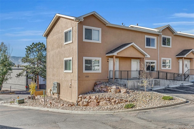 townhome / multi-family property with stucco siding