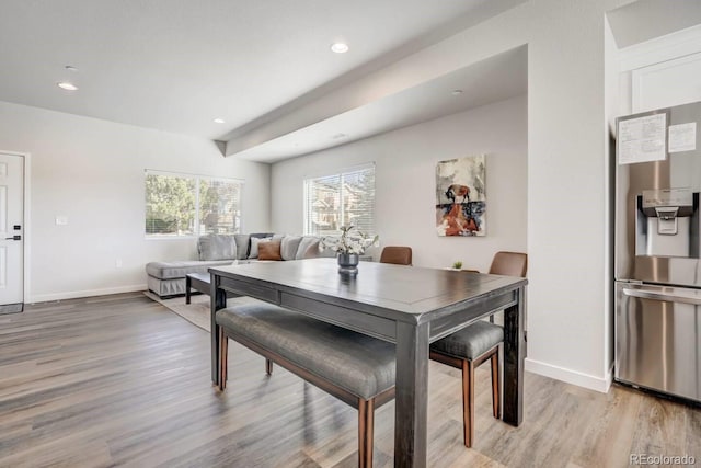 dining room featuring recessed lighting, light wood-type flooring, and baseboards