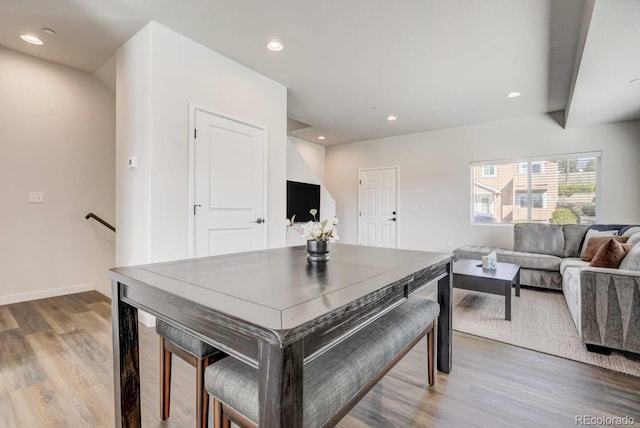 dining space with recessed lighting, light wood finished floors, and baseboards