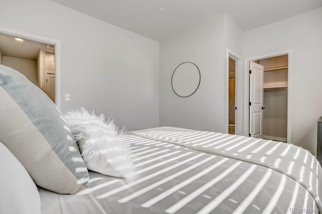 bedroom featuring a closet and a walk in closet