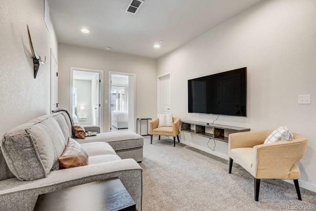 living area featuring recessed lighting, carpet, visible vents, and baseboards
