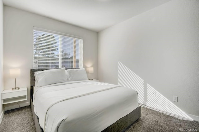 carpeted bedroom with baseboards
