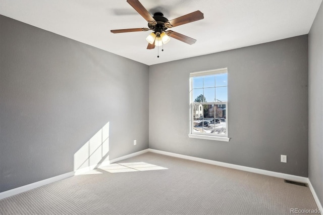 unfurnished room featuring ceiling fan and light colored carpet