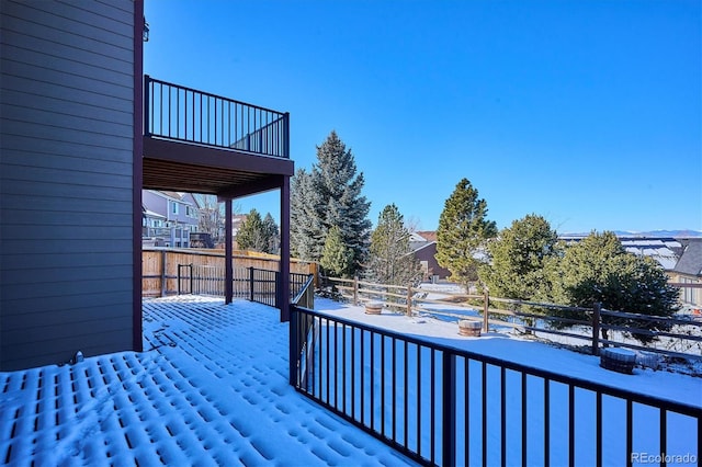 view of snow covered deck