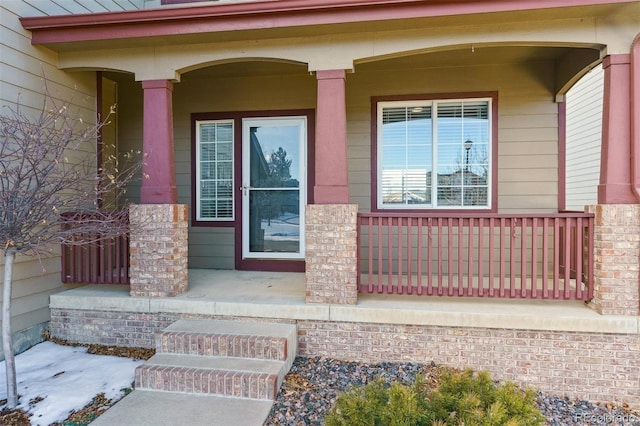 doorway to property featuring covered porch