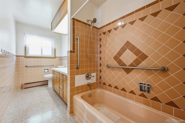 209 S 13th Ave, Brighton, CO 80601 - full bath featuring a baseboard radiator, shower / bathtub combination, tile walls, toilet, and vanity