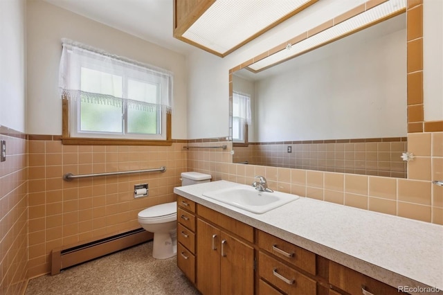 209 S 13th Ave, Brighton, CO 80601 - bathroom featuring a baseboard heating unit, toilet, vanity, tile walls, and a wainscoted wall