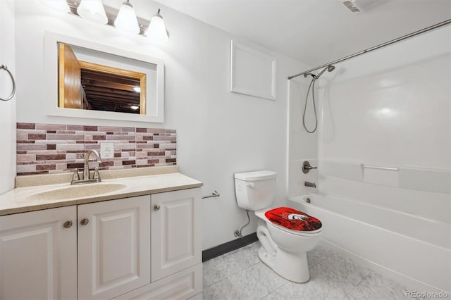 209 S 13th Ave, Brighton, CO 80601 - bathroom with toilet, vanity, backsplash,  shower combination, and baseboards