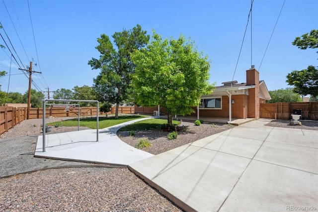 209 S 13th Ave, Brighton, CO 80601 - fenced backyard featuring a patio area