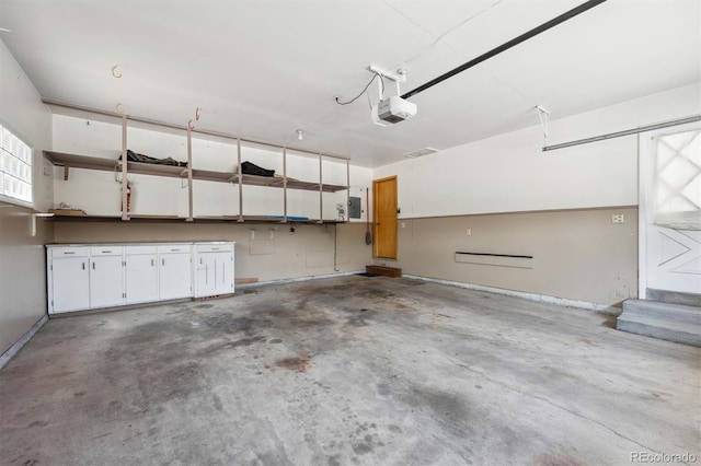 209 S 13th Ave, Brighton, CO 80601 - garage with baseboards and a garage door opener