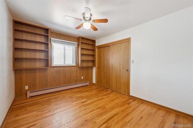 209 S 13th Ave, Brighton, CO 80601 - unfurnished bedroom with a baseboard heating unit, light wood finished floors, a closet, and ceiling fan