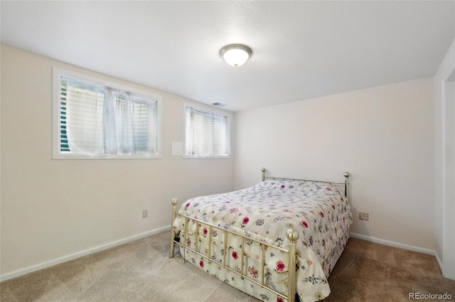 carpeted bedroom with baseboards
