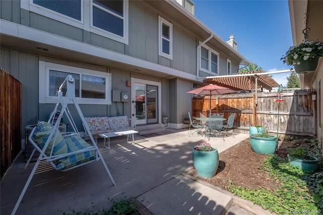 view of patio / terrace featuring fence and outdoor dining area