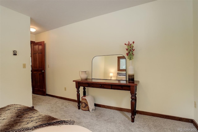 bedroom featuring light carpet