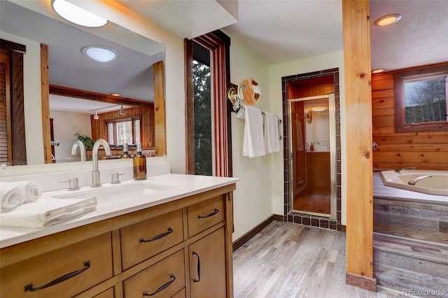 bathroom with vanity, an enclosed shower, and hardwood / wood-style flooring