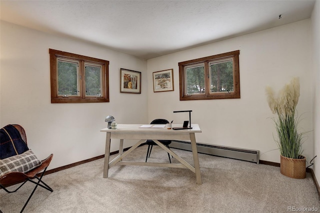 carpeted home office with a textured ceiling and a baseboard heating unit