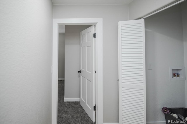 hallway featuring carpet