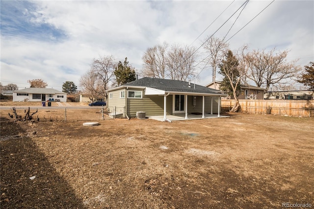 rear view of property featuring cooling unit and a patio area