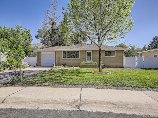 2617 Cedar Dr, Loveland, CO 80538 - single story home featuring concrete driveway, a garage, and brick siding