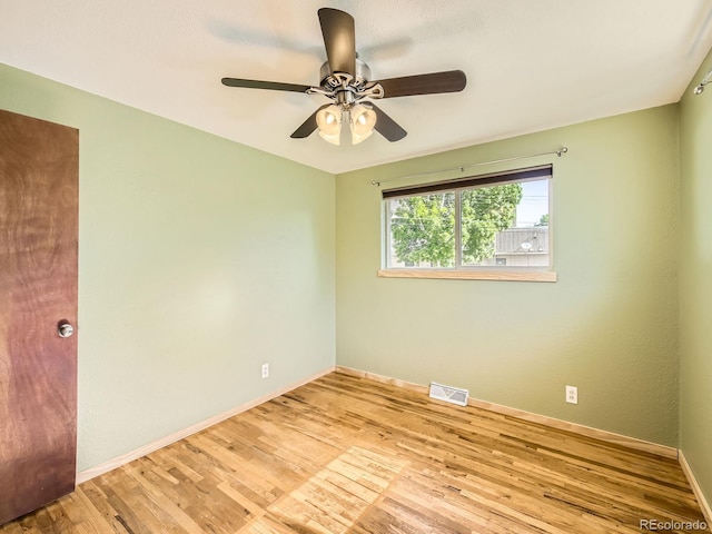 2617 Cedar Dr, Loveland, CO 80538 - empty room with baseboards, wood finished floors, and a ceiling fan