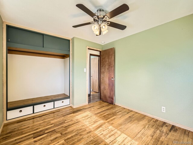 2617 Cedar Dr, Loveland, CO 80538 - unfurnished bedroom with light wood-type flooring, baseboards, a closet, and a ceiling fan