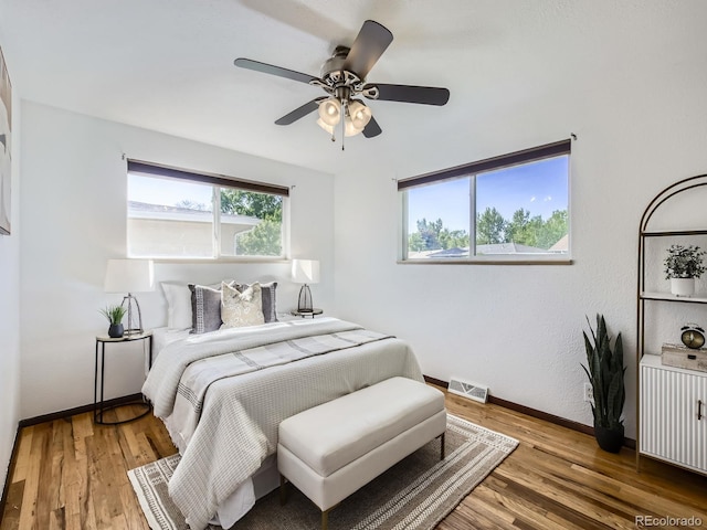 2617 Cedar Dr, Loveland, CO 80538 - bedroom featuring baseboards, wood finished floors, and ceiling fan
