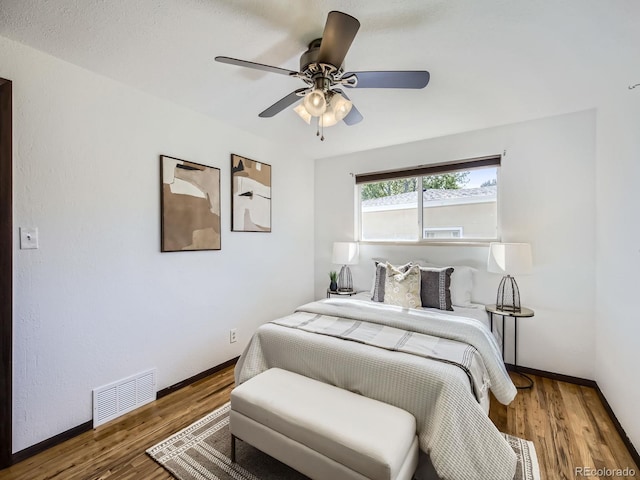 2617 Cedar Dr, Loveland, CO 80538 - bedroom with wood finished floors, a ceiling fan, and baseboards