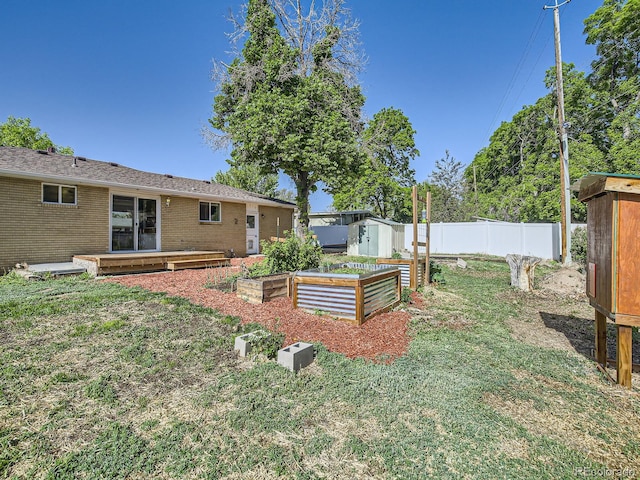 2617 Cedar Dr, Loveland, CO 80538 - view of yard with a storage shed, a garden, and an outbuilding