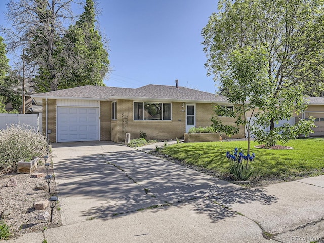 2617 Cedar Dr, Loveland, CO 80538 - ranch-style house featuring brick siding, an attached garage, driveway, and a shingled roof