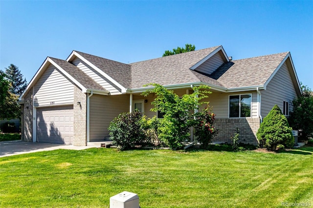1155 Black Hawk Rd, Eaton, CO 80615 - ranch-style house featuring an attached garage, a shingled roof, a front yard, brick siding, and concrete driveway