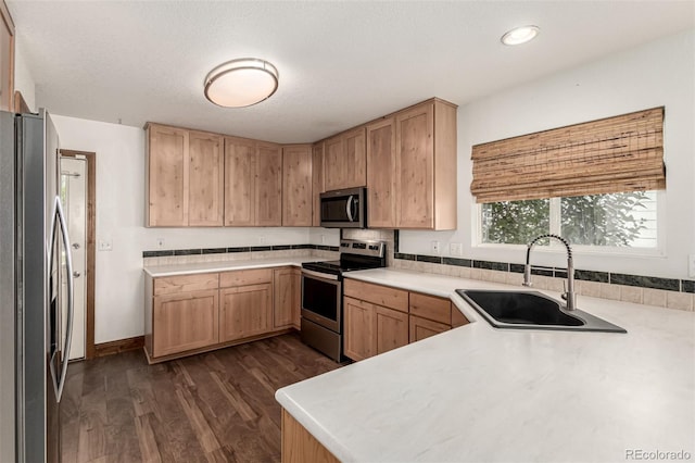 1155 Black Hawk Rd, Eaton, CO 80615 - kitchen with appliances with stainless steel finishes, dark wood-type flooring, light countertops, light brown cabinets, and recessed lighting
