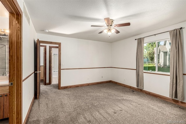 1155 Black Hawk Rd, Eaton, CO 80615 - carpeted spare room with ceiling fan, a textured ceiling, and a smoke detector