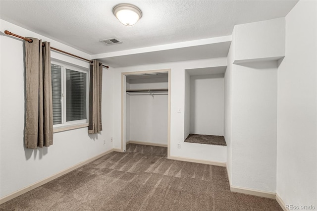1155 Black Hawk Rd, Eaton, CO 80615 - unfurnished bedroom with carpet, a closet, and a textured ceiling