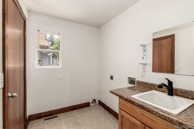 1155 Black Hawk Rd, Eaton, CO 80615 - washroom with hookup for an electric dryer, hookup for a washing machine, and light tile patterned flooring