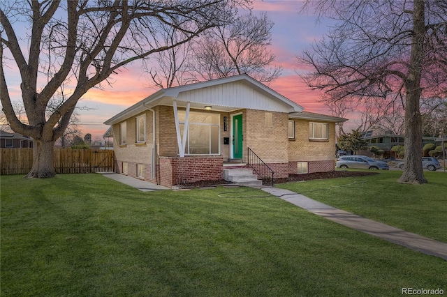 view of front of house with a yard