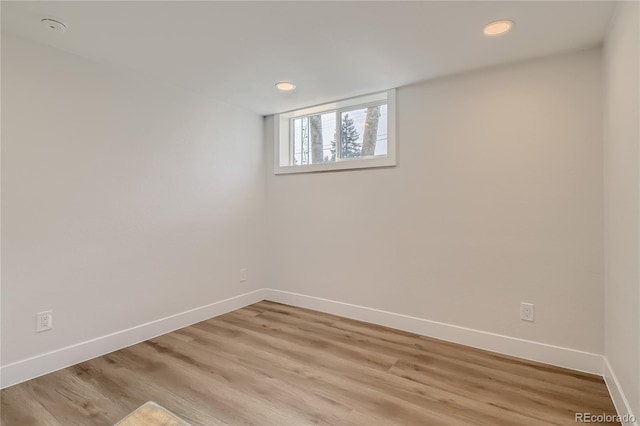 unfurnished room with light hardwood / wood-style flooring