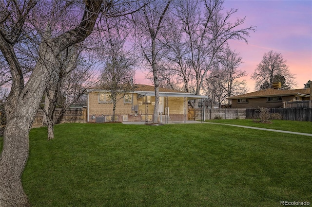 view of front of property with a yard