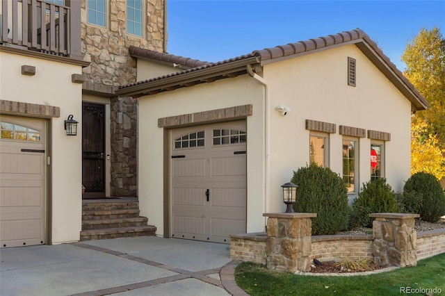 view of side of property with a garage