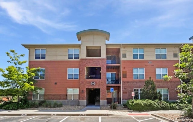4100 Albion St Unit 523, Denver, CO 80216 - view of apartment building / complex with uncovered parking