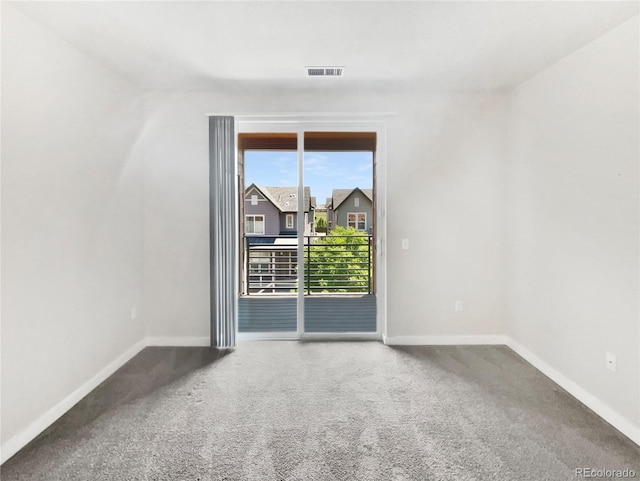 4100 Albion St Unit 523, Denver, CO 80216 - empty room featuring baseboards and carpet floors