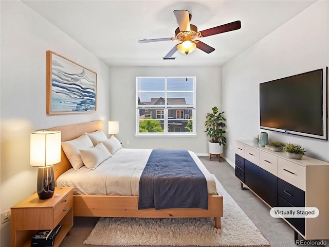 4100 Albion St Unit 523, Denver, CO 80216 - bedroom featuring light colored carpet and ceiling fan