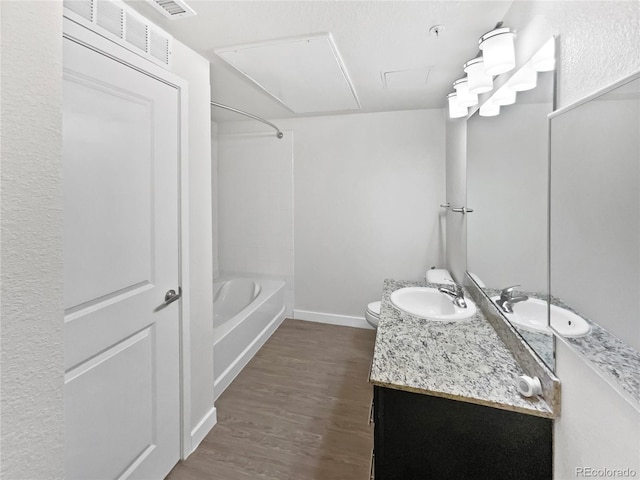 4100 Albion St Unit 523, Denver, CO 80216 - bathroom featuring vanity, wood finished floors, and shower / bathtub combination