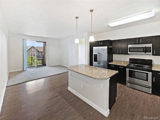 4100 Albion St Unit 523, Denver, CO 80216 - kitchen with stainless steel appliances, dark cabinetry, a kitchen island, and dark wood finished floors
