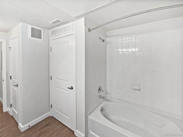 4100 Albion St Unit 523, Denver, CO 80216 - full bathroom with wood finished floors and tub / shower combination