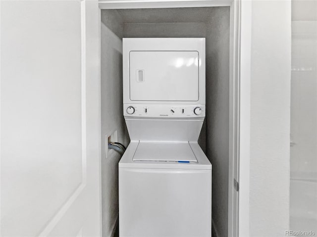 4100 Albion St Unit 523, Denver, CO 80216 - laundry area with estacked washer and dryer