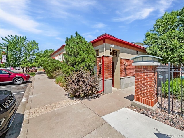 4100 Albion St Unit 523, Denver, CO 80216 - view of side of home with brick siding