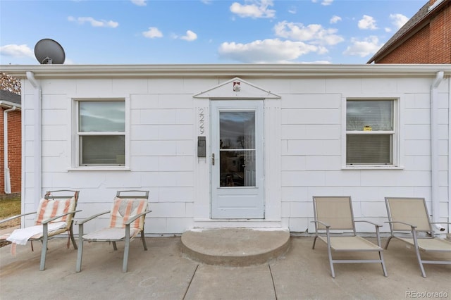 doorway to property featuring a patio