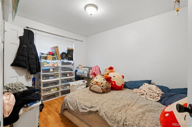 bedroom with wood-type flooring